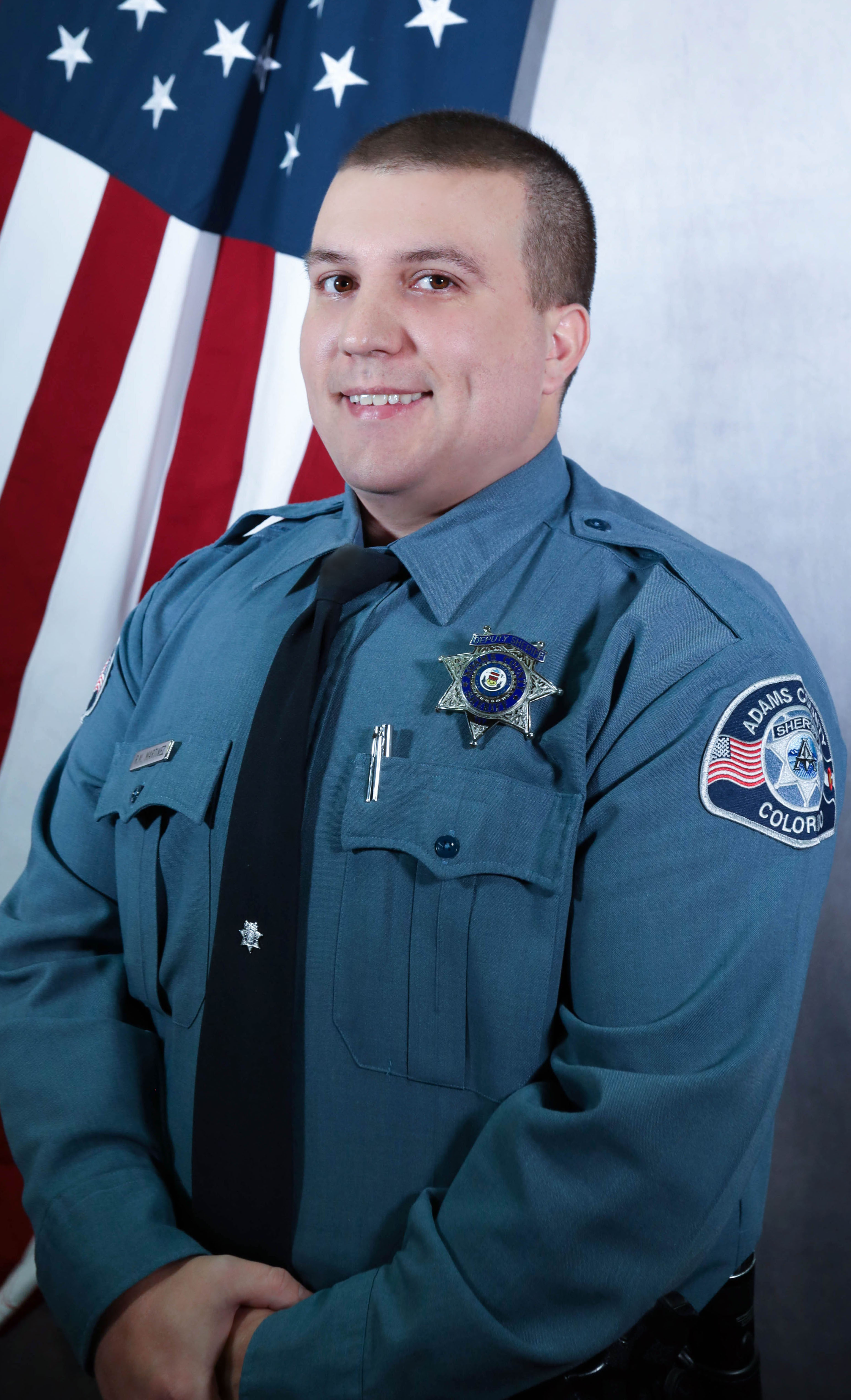 Agency photo of Sr. Deputy Martinez, the Adams County Sheriff's Office recruiter.